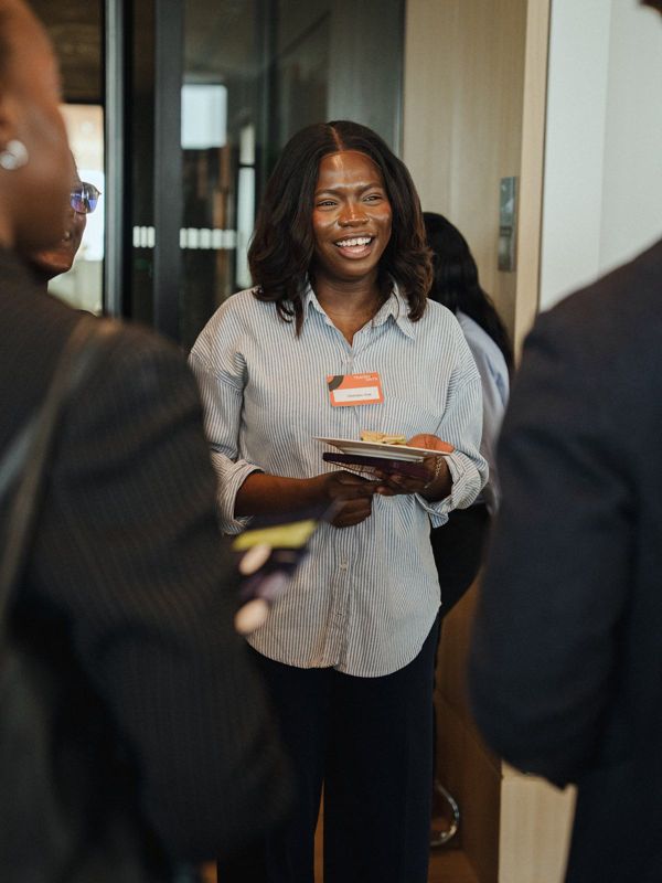 A WCAN member smiling at an event